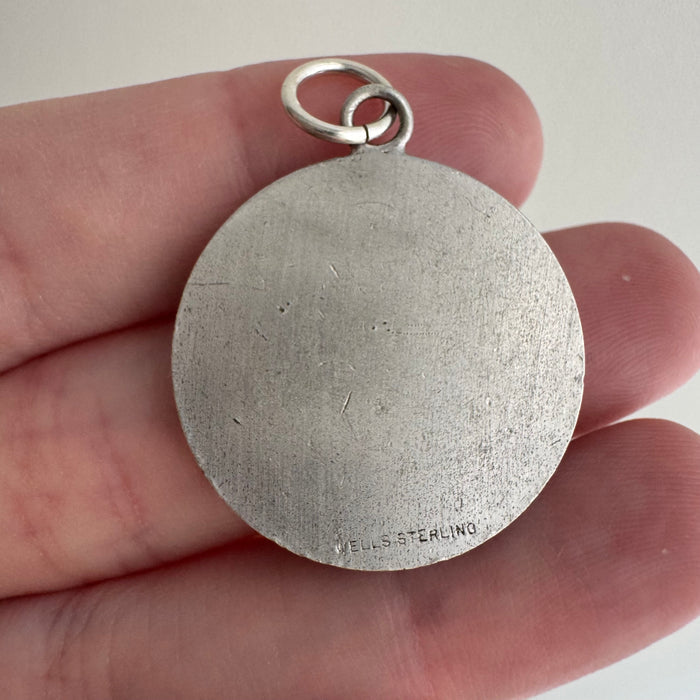 V I N T A G E // pouring from a full vessel / sterling silver figure pouring from a vase / a pendant